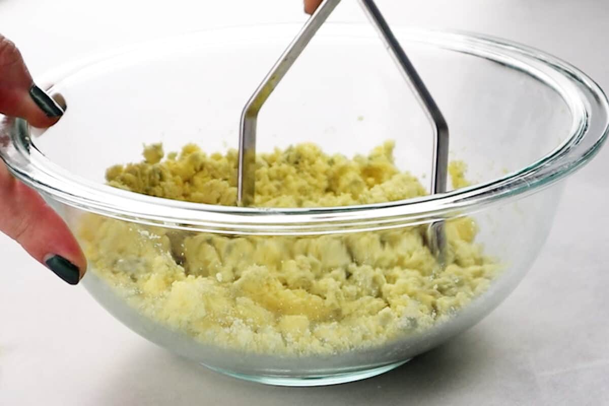 mashing the egg yolks