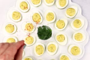 sprinkled paprika on Smoked Deviled Eggs