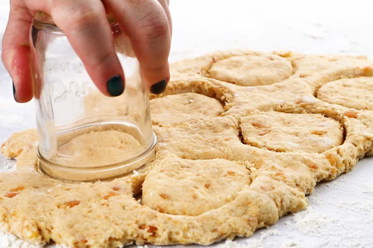 using a mason jar to cut biscuits