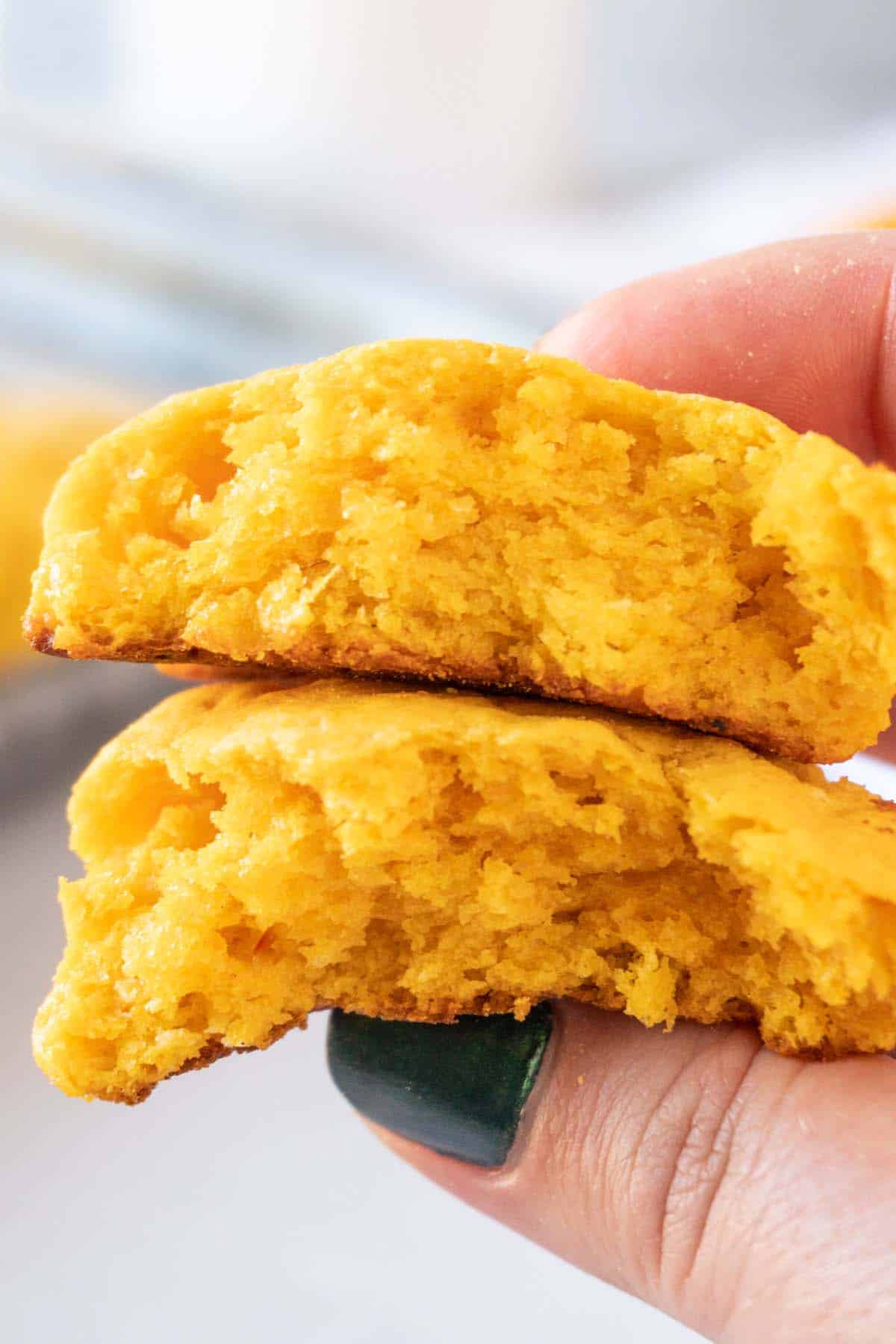 sweet potato biscuits broken in half held in hand