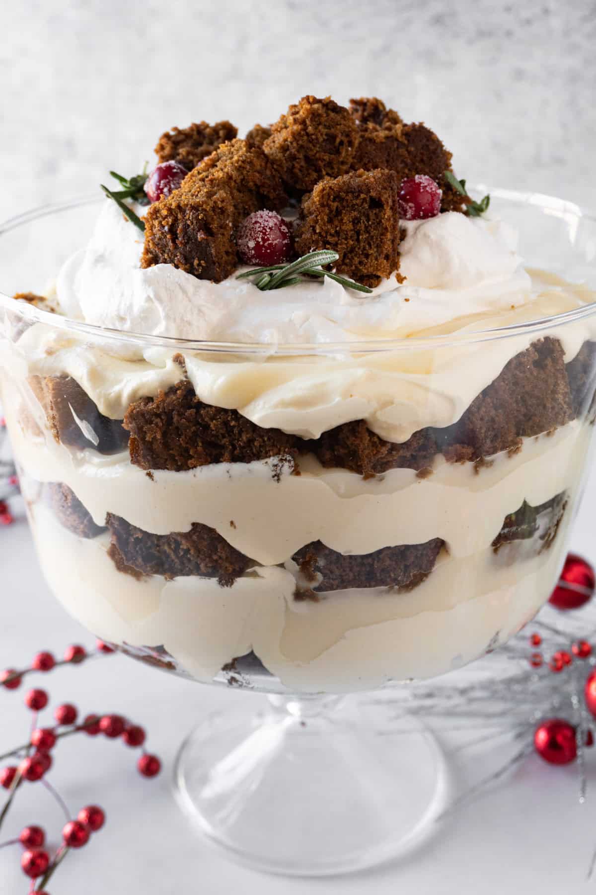Gingerbread Trifle in Trifle dish showing beautiful distinct layers of cake, pudding, and whipped topping fluff.