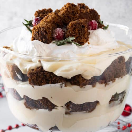 Gingerbread Trifle in Trifle dish showing beautiful distinct layers of cake, pudding, and whipped topping fluff, featured image