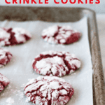 red velvet crinkle cookies on parchment lined baking sheet pinterest pin.