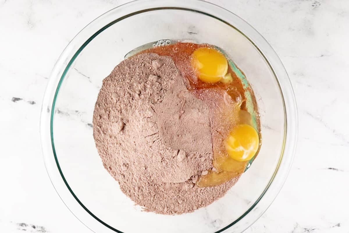 adding ingredients to cookies in bowl