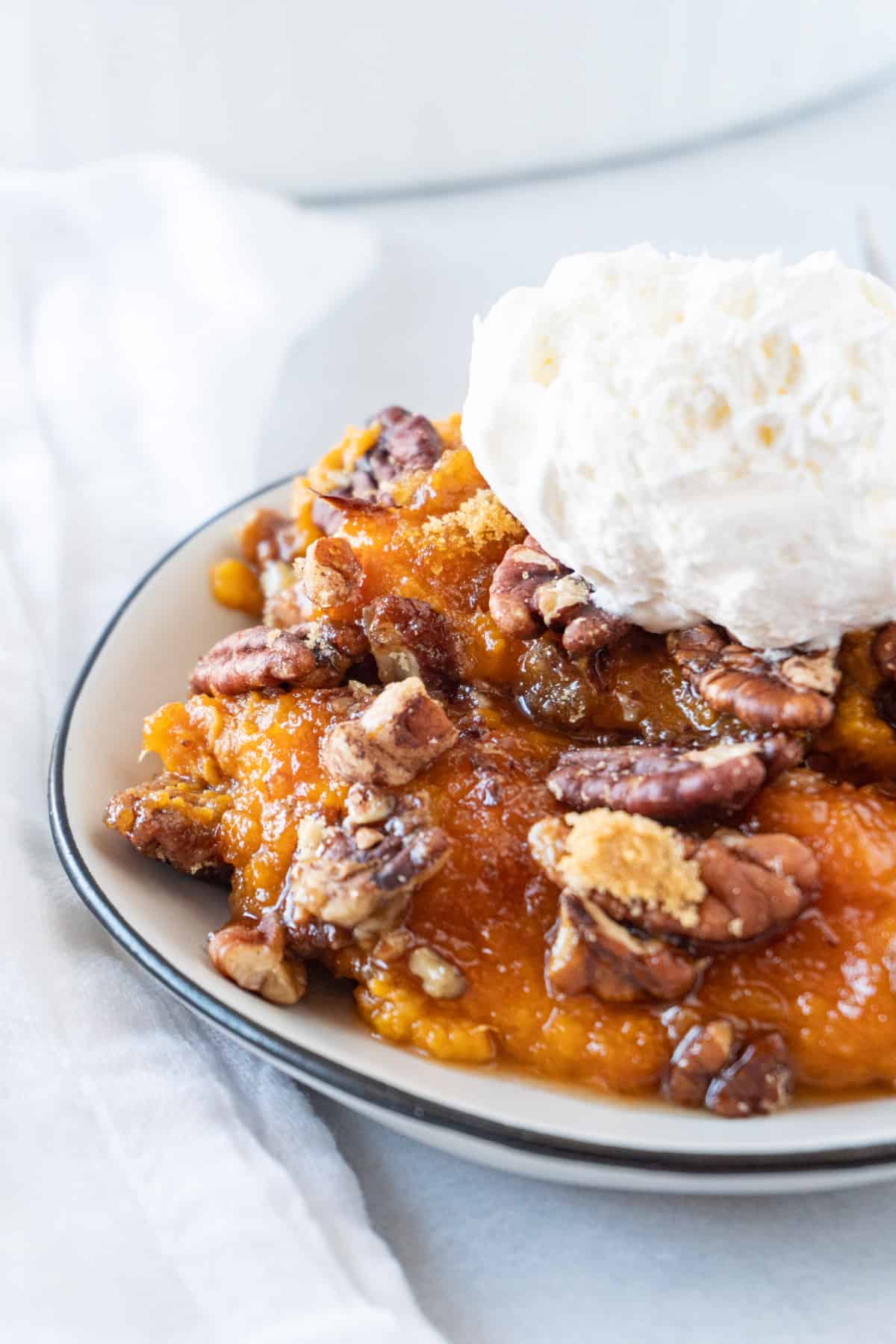 sweet potato pudding with whipped topping on top