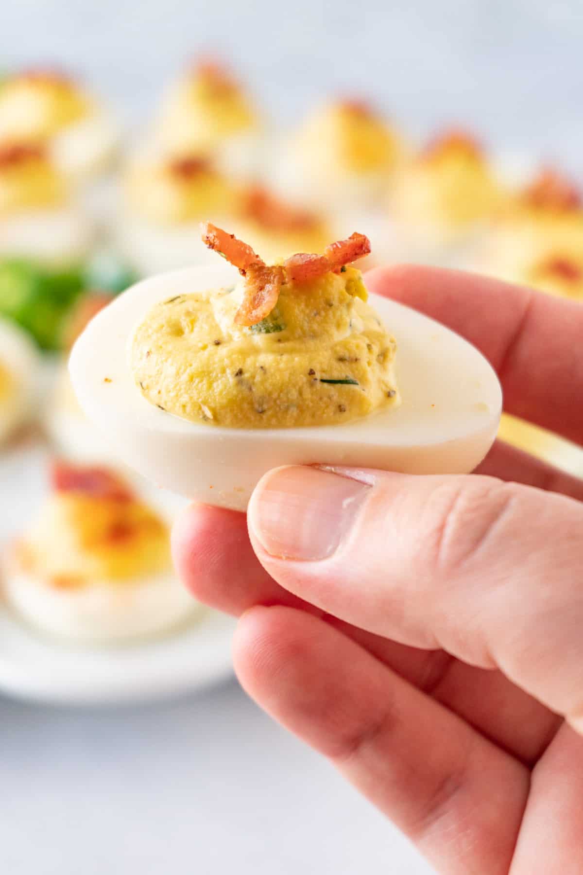 holding a jalapeno deviled egg