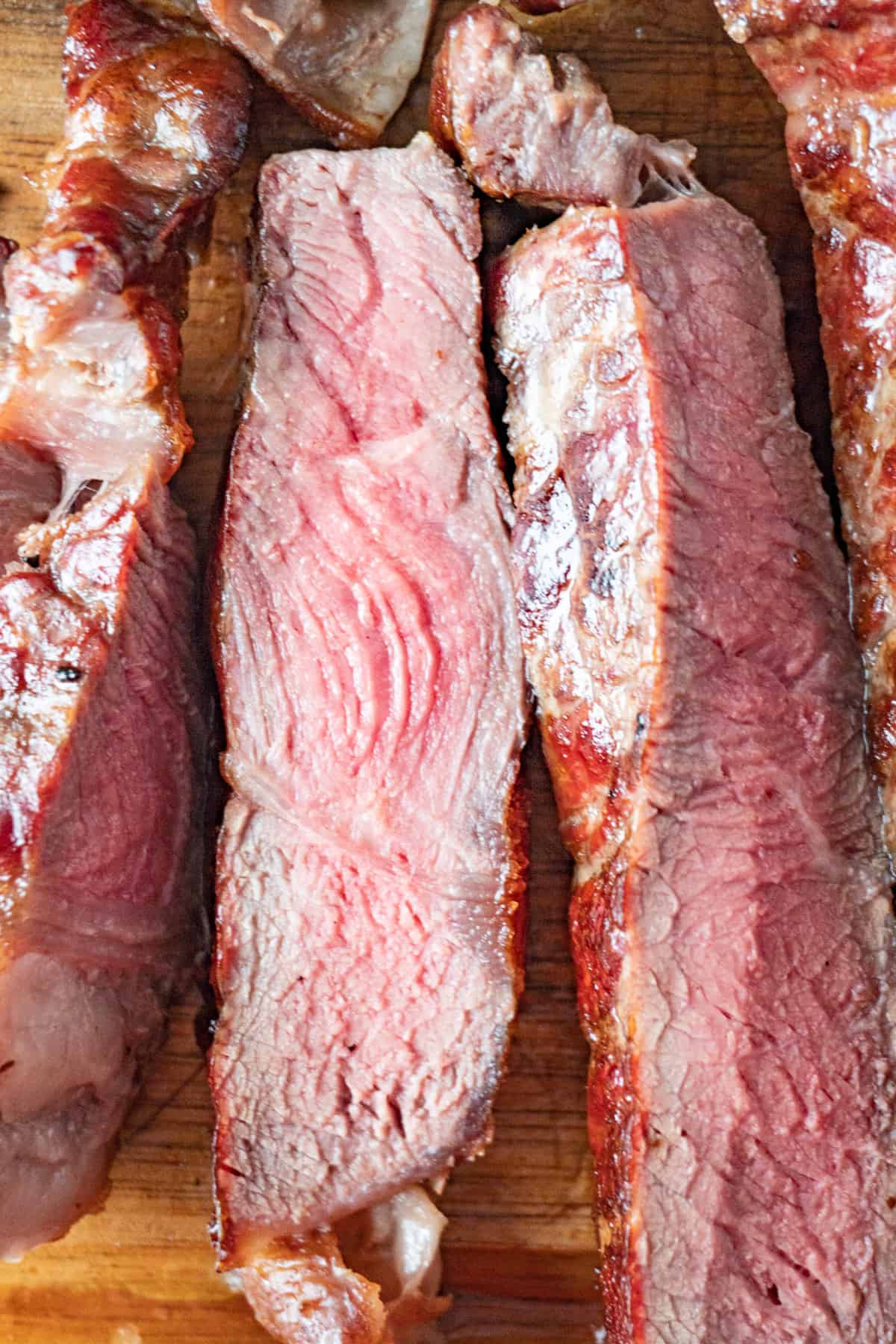 smoked ribeye pieces with pink center close up