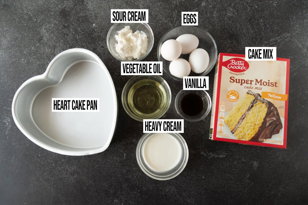 heart cake ingredients in their own bowls.