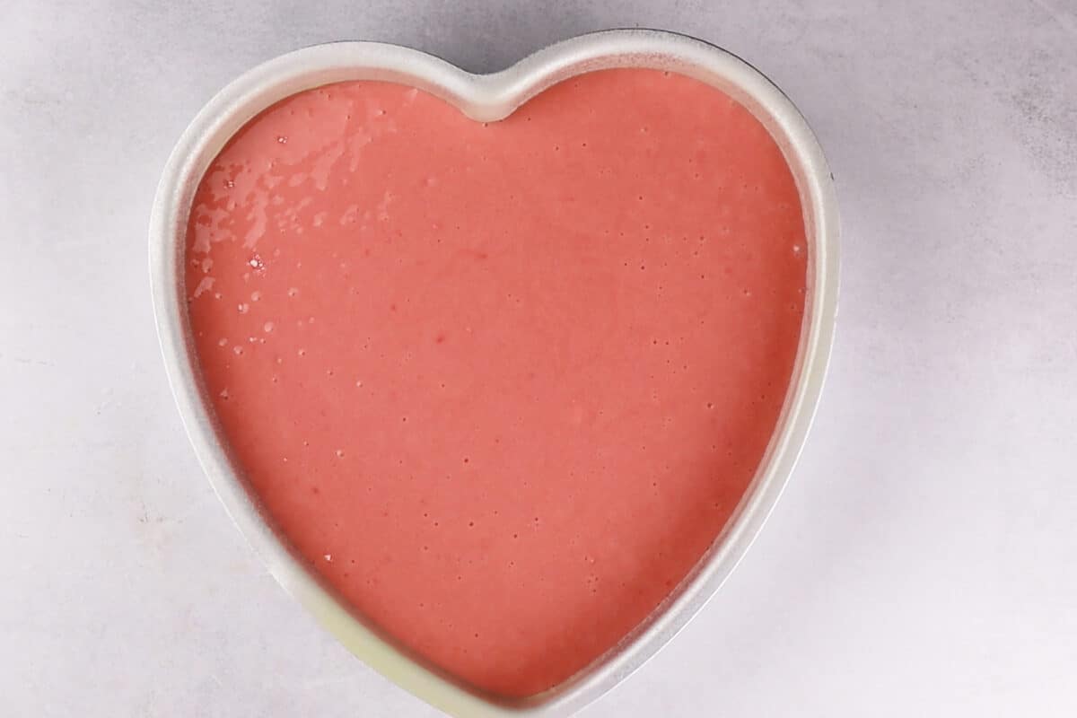 cake patter in heart pan before baking