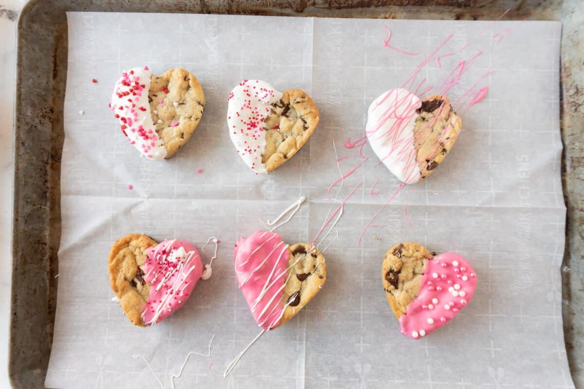 heart shaped chocolate chip cookies decorated on baking sheet