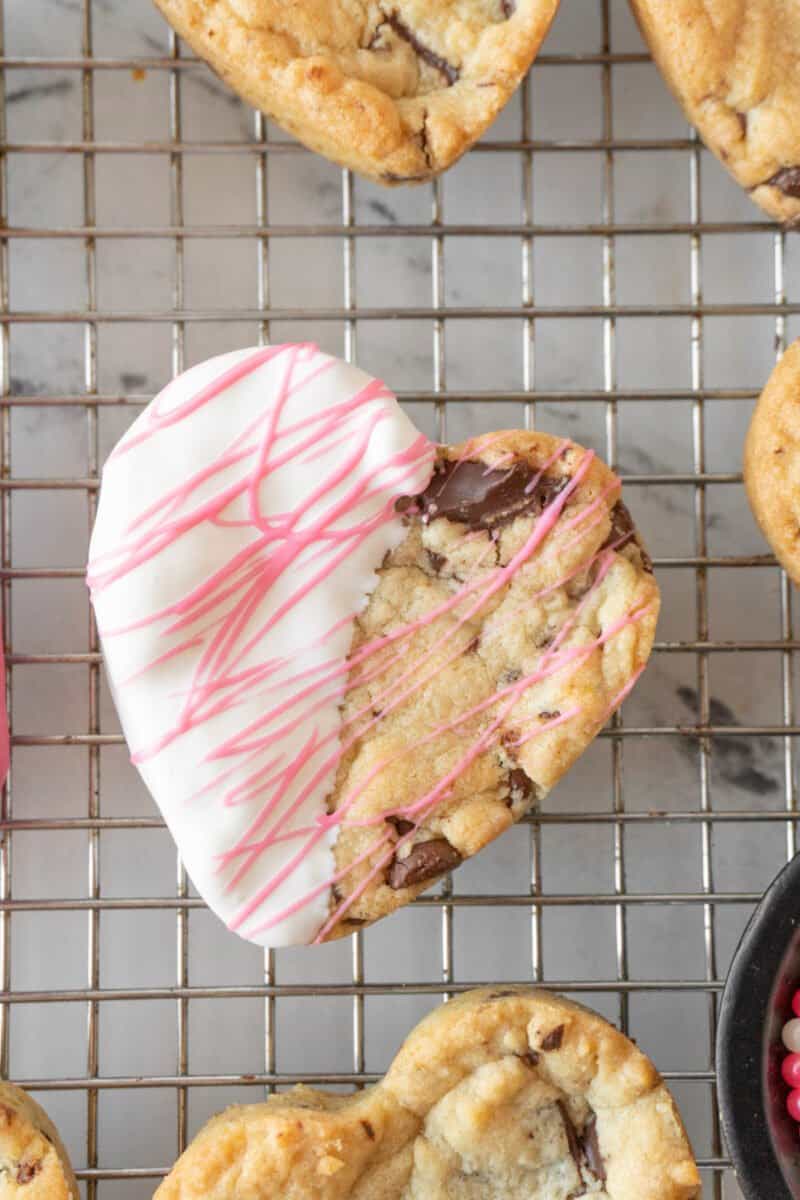 heart shaped chocolate chip cookie half whote with pink strips