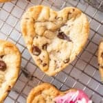 heart shaped chocolate chip cookie on bcooling rack featured image
