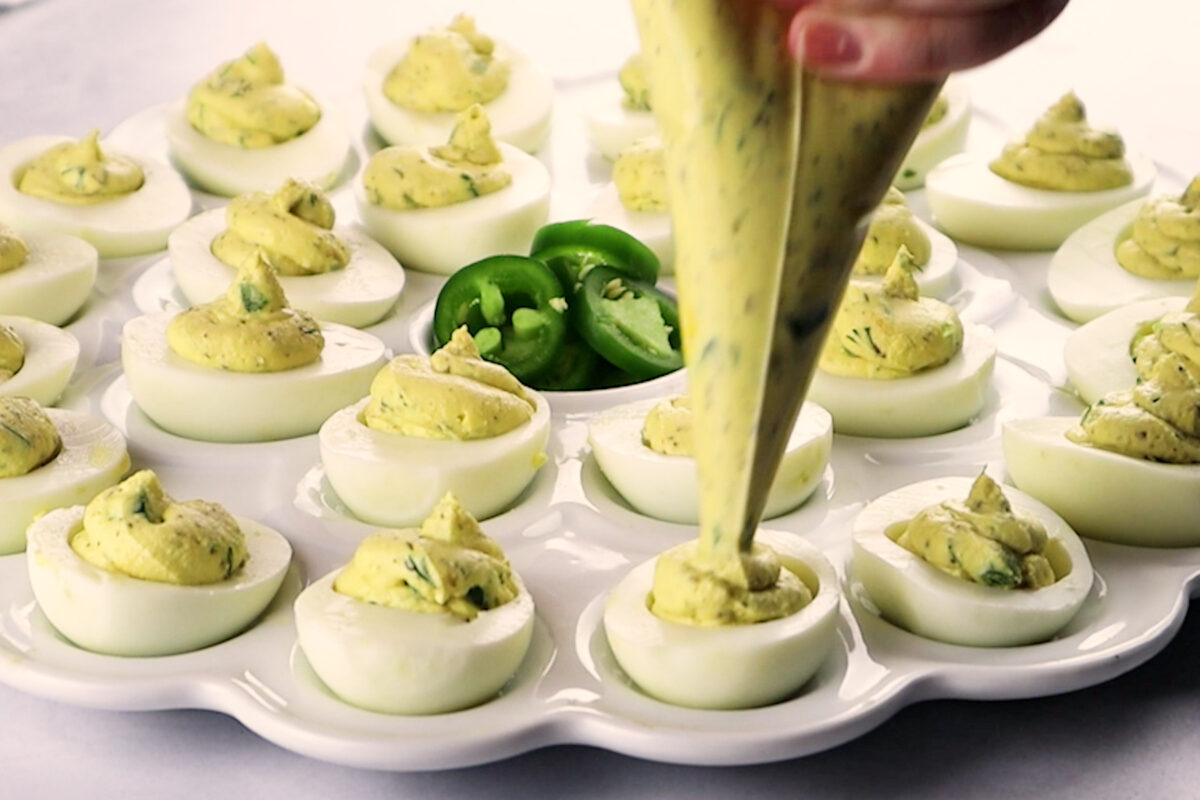 piping filling into egg whites