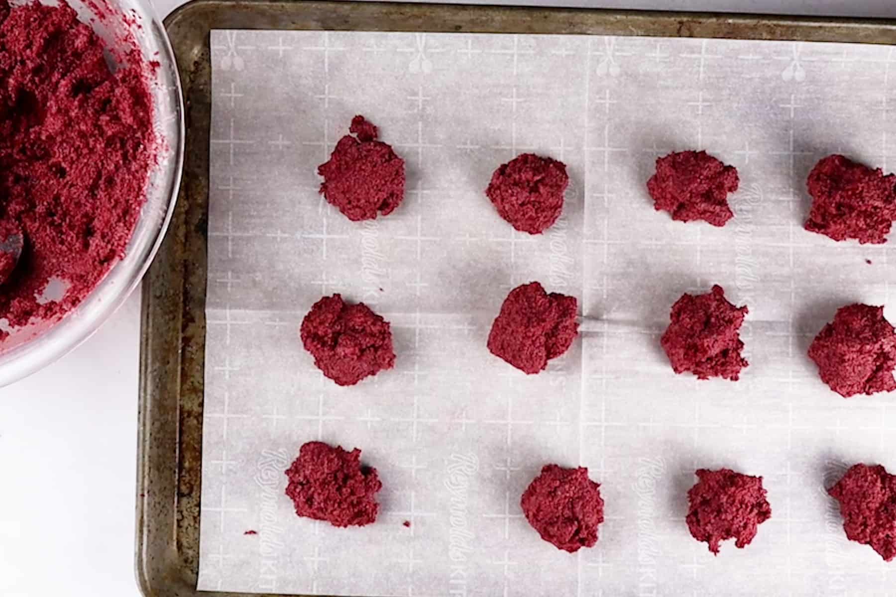 cake balls spooned out on baking sheet