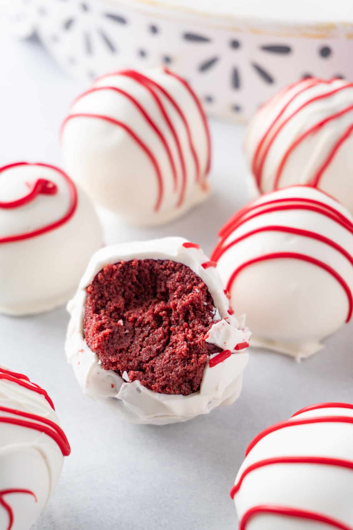 red velvets cake balls one with a bite taken out