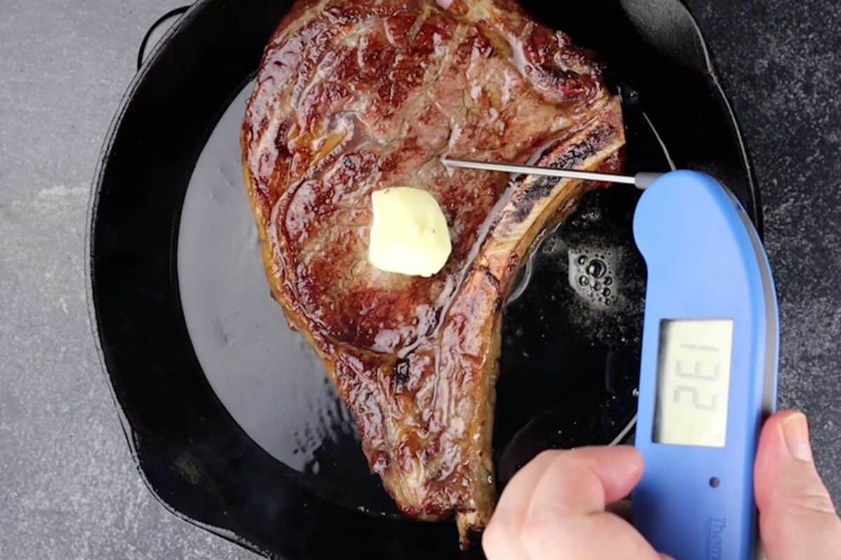 smoked ribeye with thermometer in it