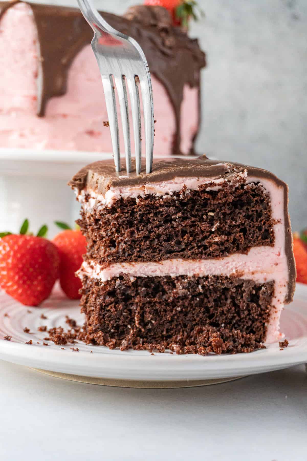 sticking a fork into a slice of cake
