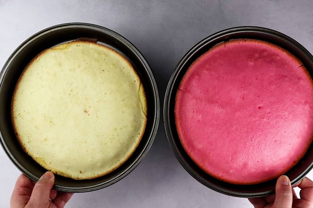 pink and white cake in cake pan after baking