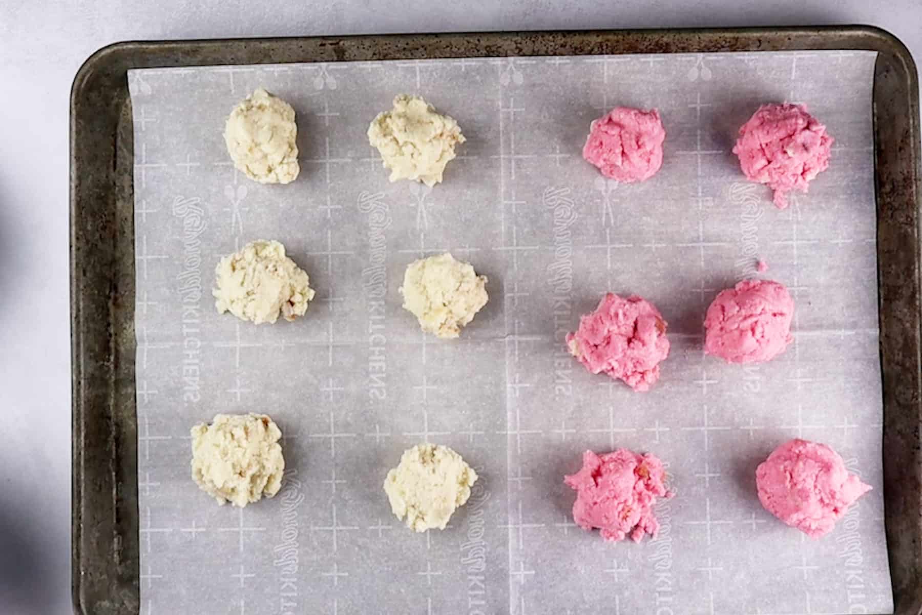 spoonful of cake/frosting mix on baking sheet.