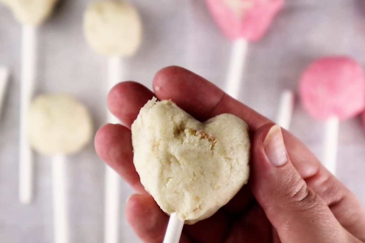 adding cake pop stick to heart