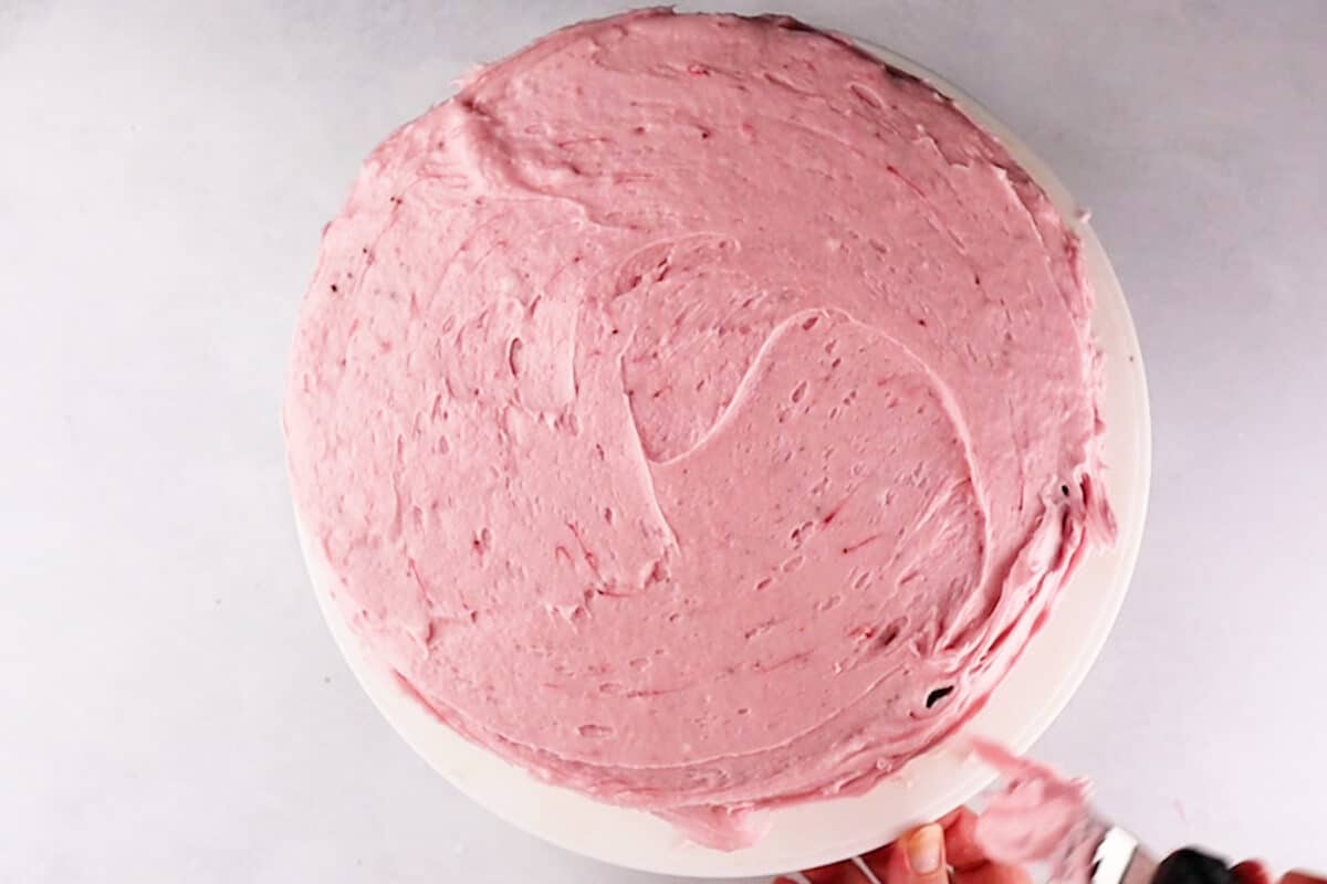 cake frosted with strawberry buttercream