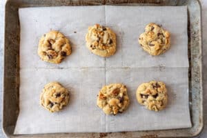 walnut chocolate chip cookies on baking sheet after being baked
