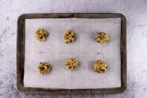 spoonfuls of cookie dough on baking sheet