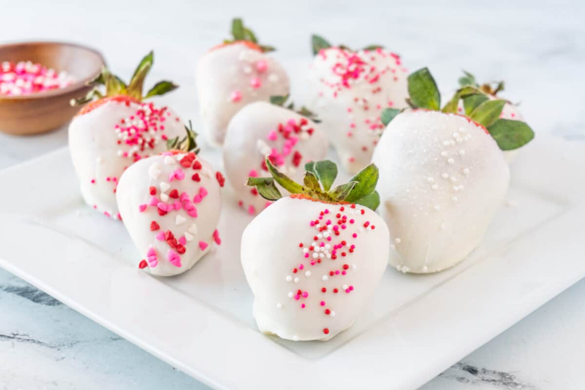white chocolate covered strawberries on plate