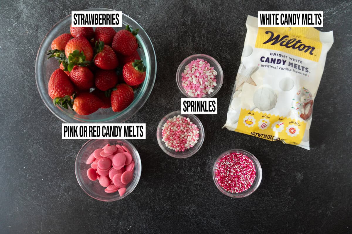 white chocolate covered strawberries ingredients in individual bowls.
