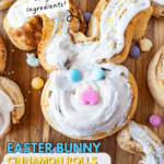 bunny shaped cinnamon roll with icing and candies on cutting board pinterest pin