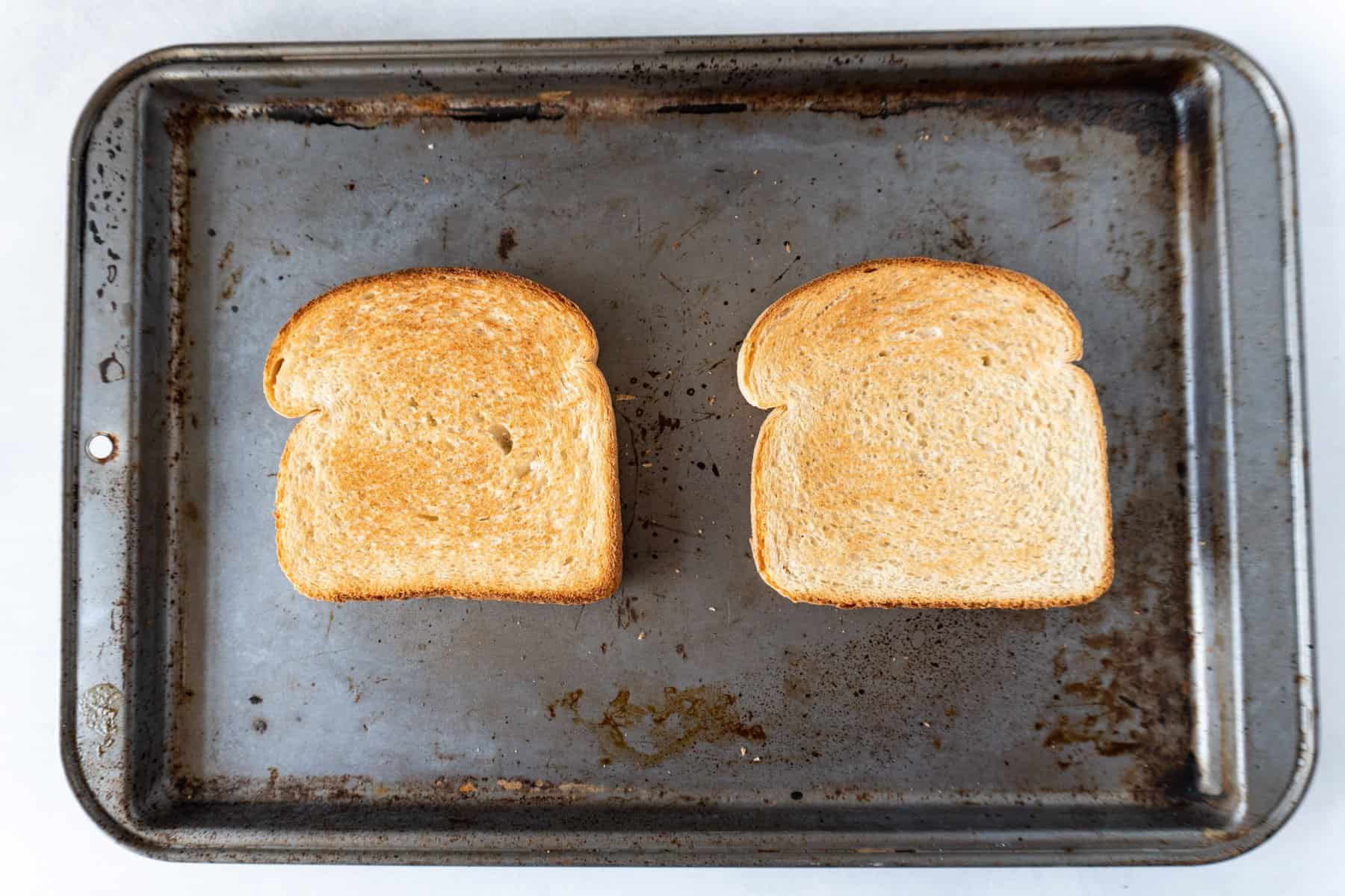 toasted white bread on baking sheet