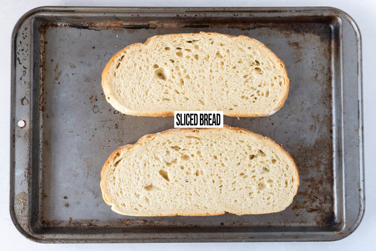 sliced sourdough on baking sheet.