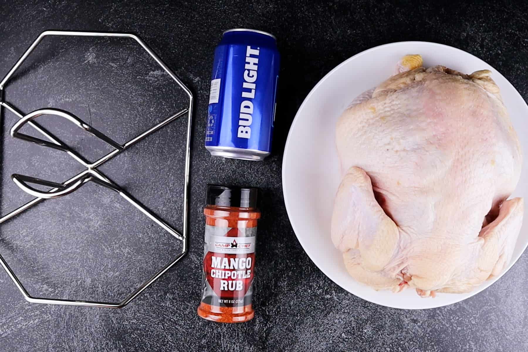 ingredients for beer can chicken (beer, rub, chicken, and beer holder)