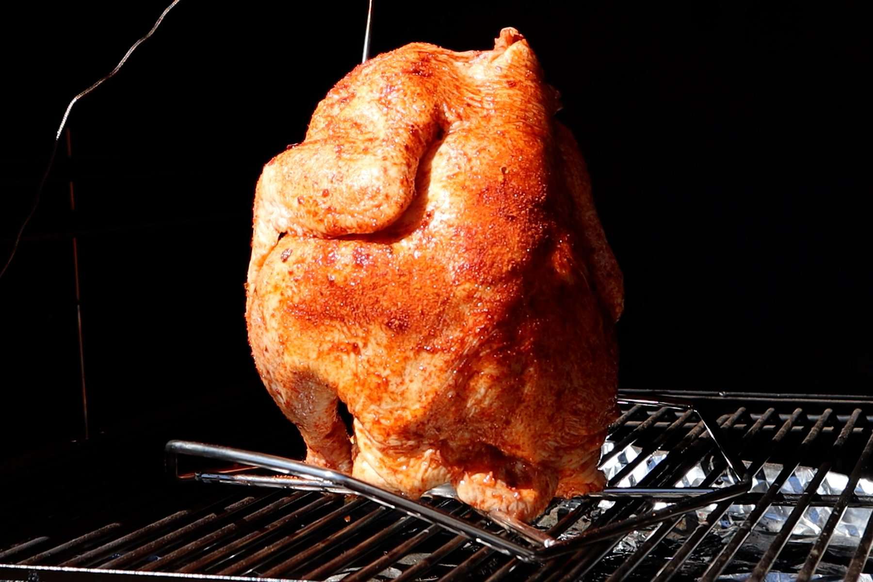 smoked beer can chicken in smoker before being cooked