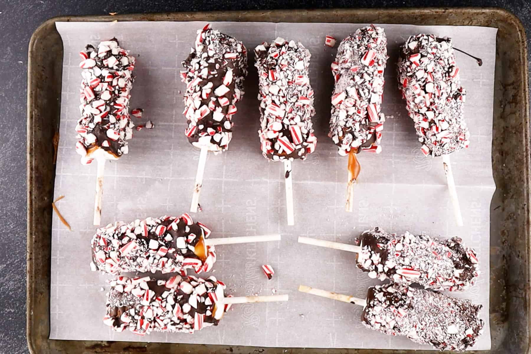 peppermint marshmallow wands on baking sheet