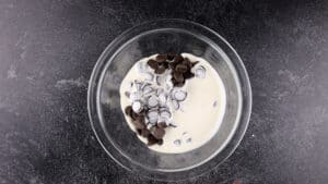 chocolate and cream in bowl before heating