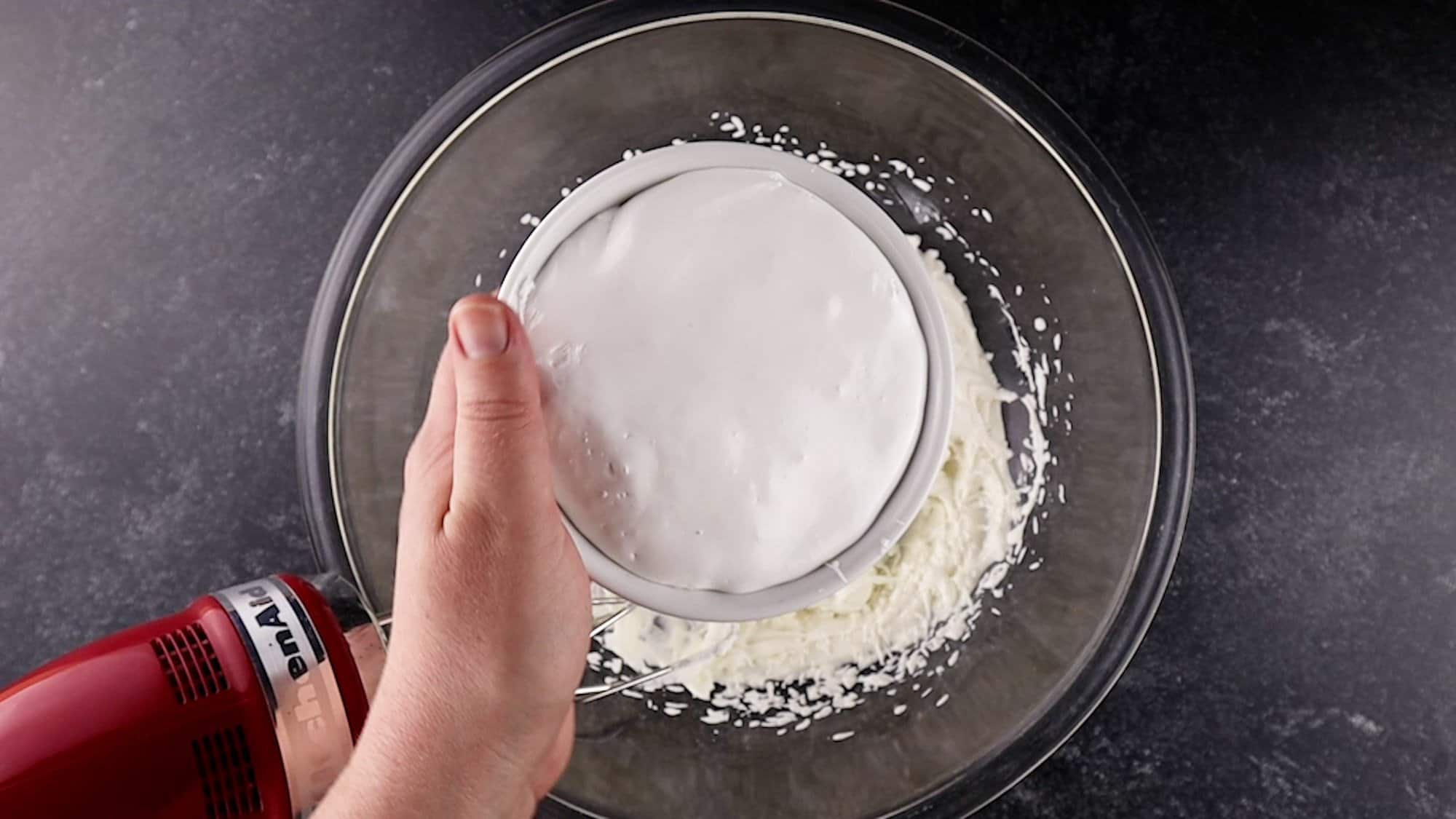 adding marshmallow cream to whipped heavy cream