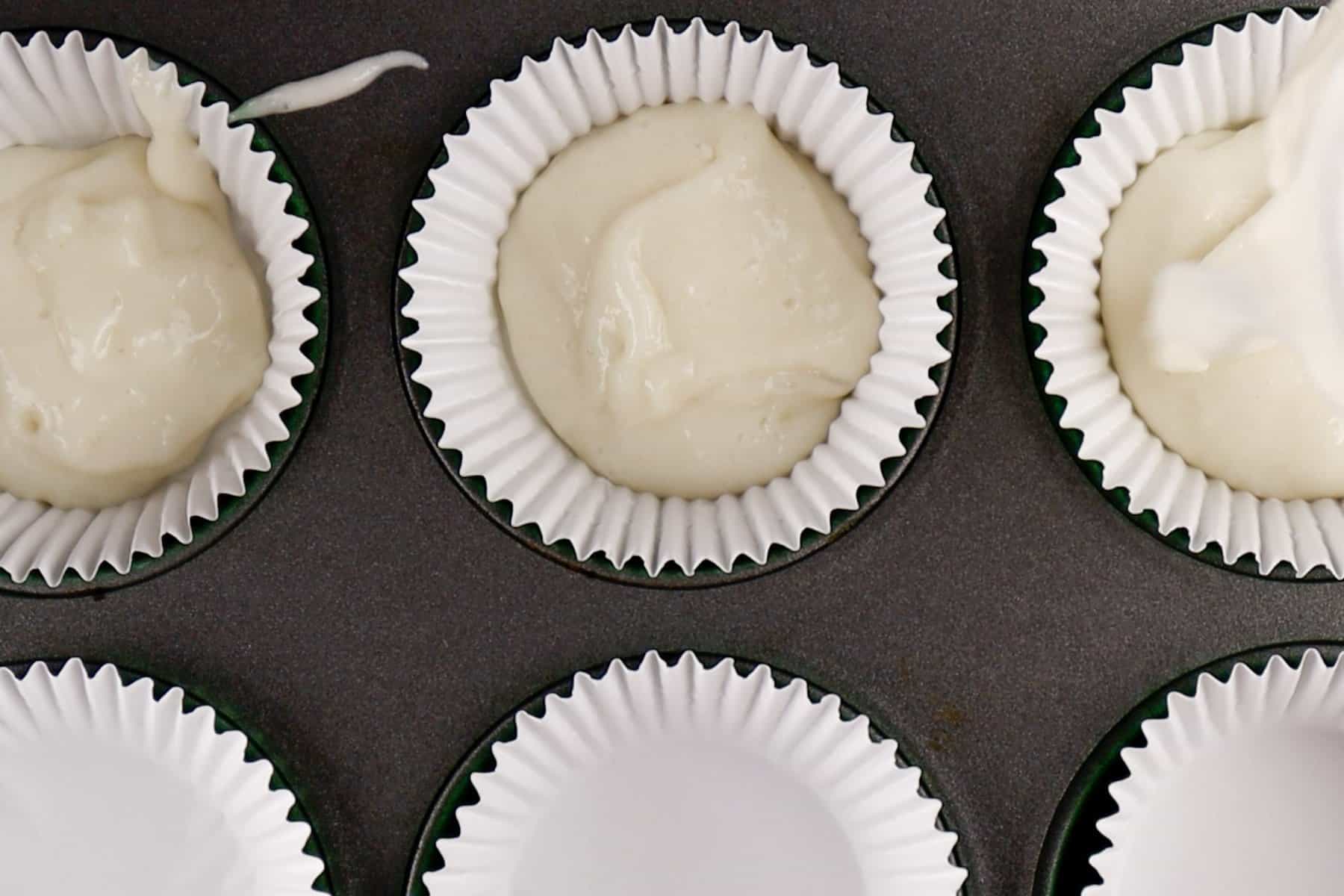 small amount of batter in bottom of cupcake liner