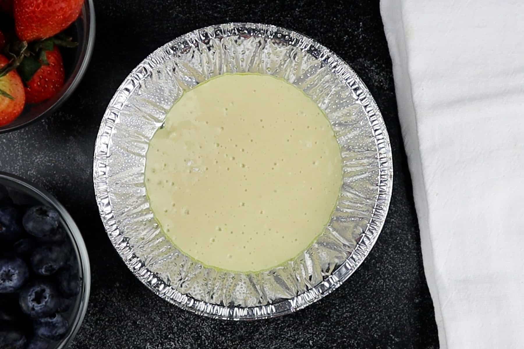 pancake batter in aluminum pan.