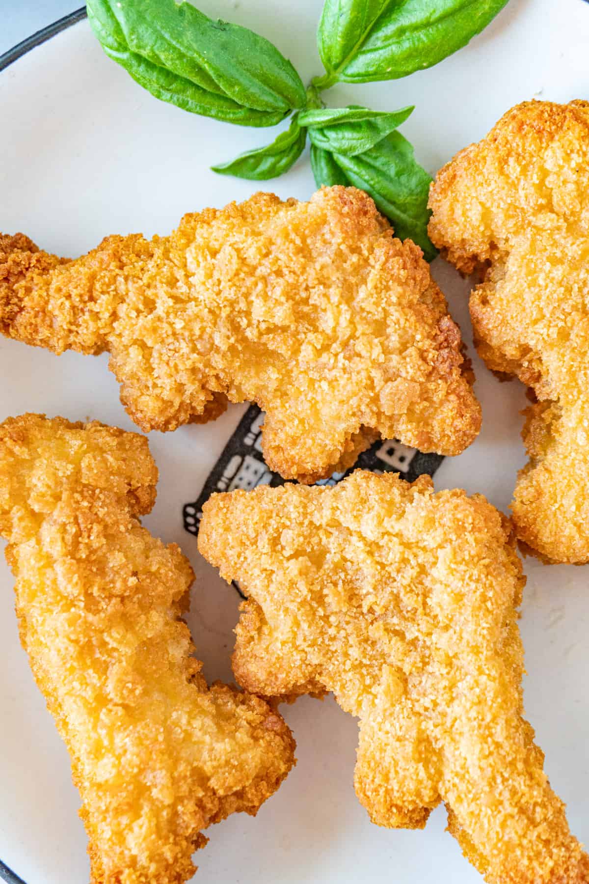 close up of dino nuggets on plate.