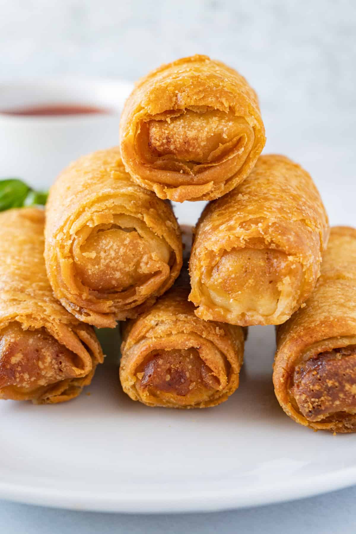 golden egg rolls stacked on one another.