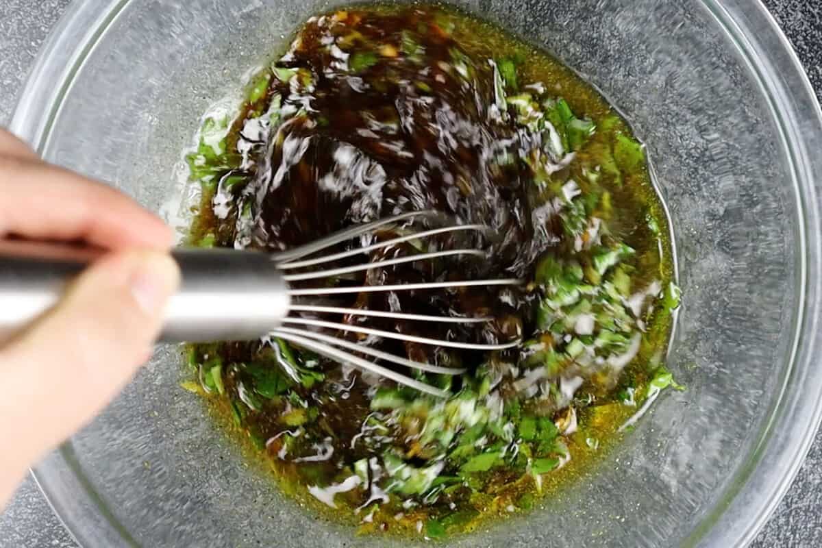 whisking the marinade.