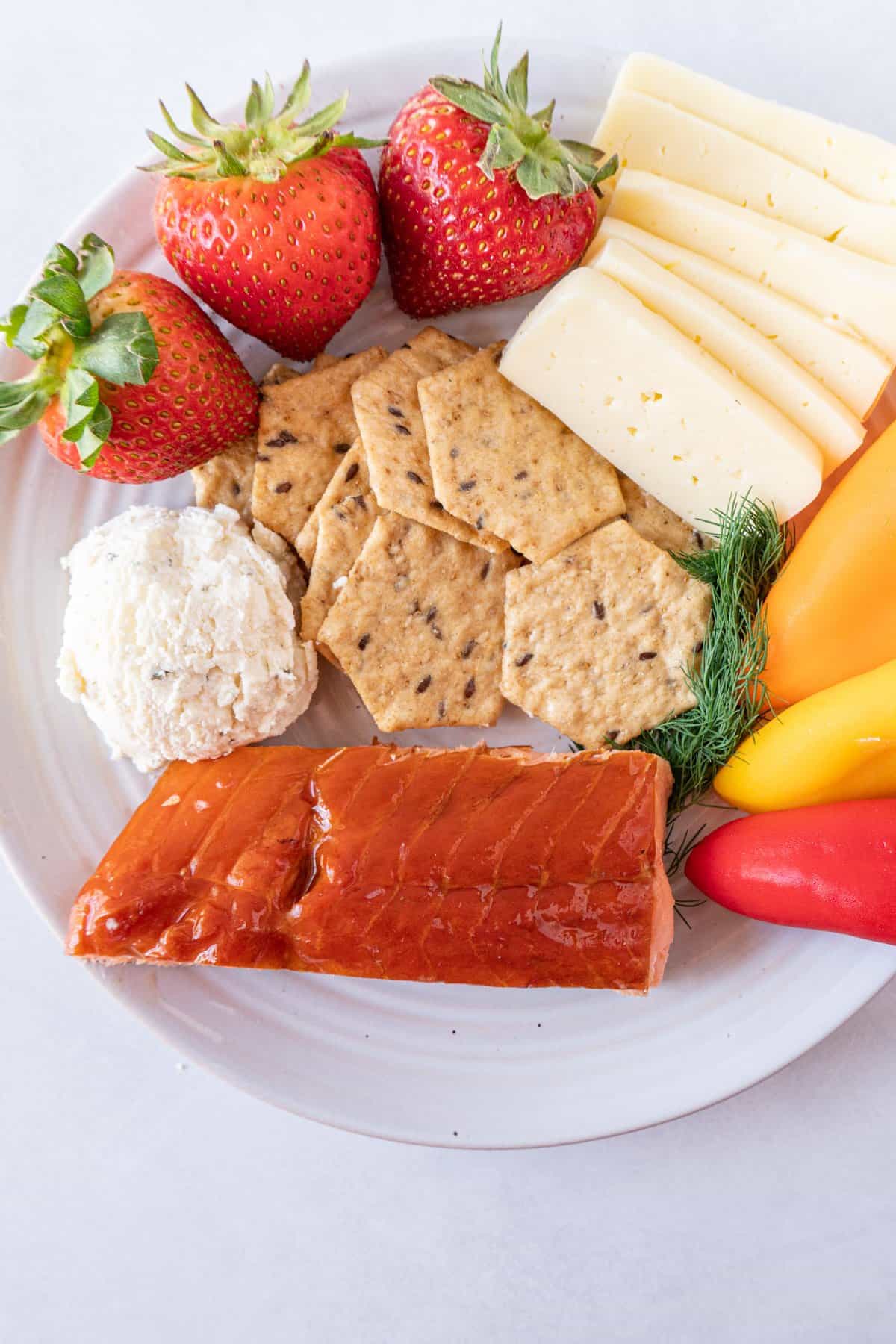 smoked salmon on cheese and veggie plate