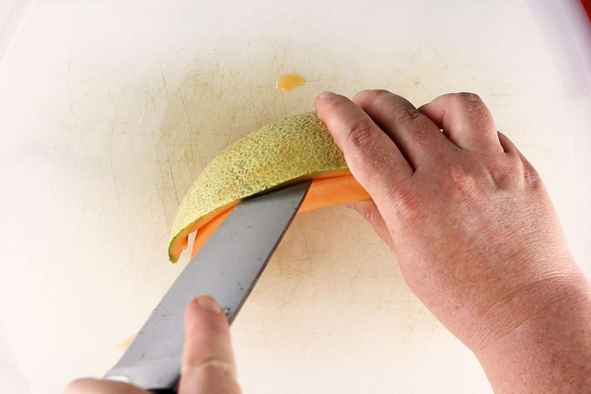 cutting rind from fruit