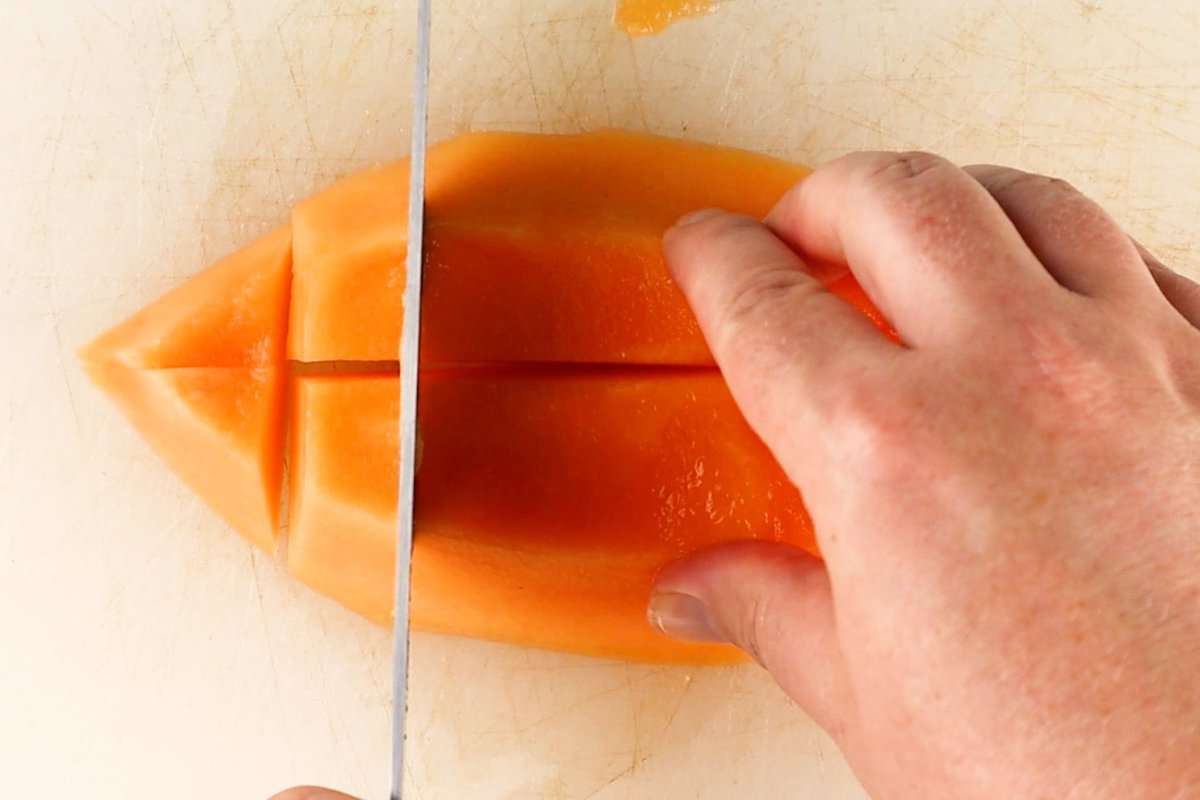 cutting quarter of cantaloupe into squares