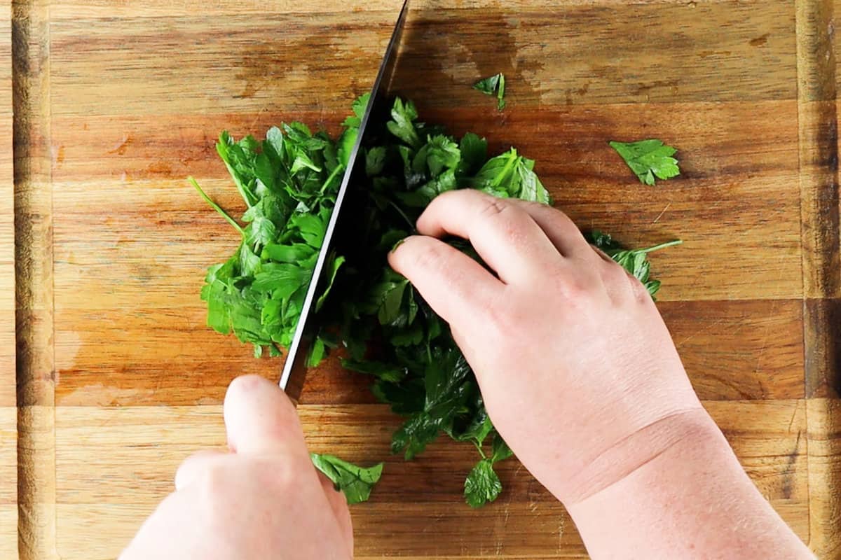 chopping parsley left to right.