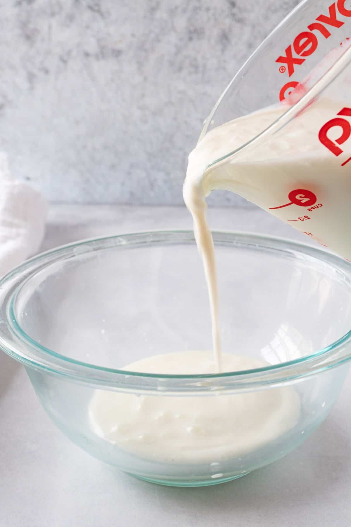 pouring good buttermilk into a bowl