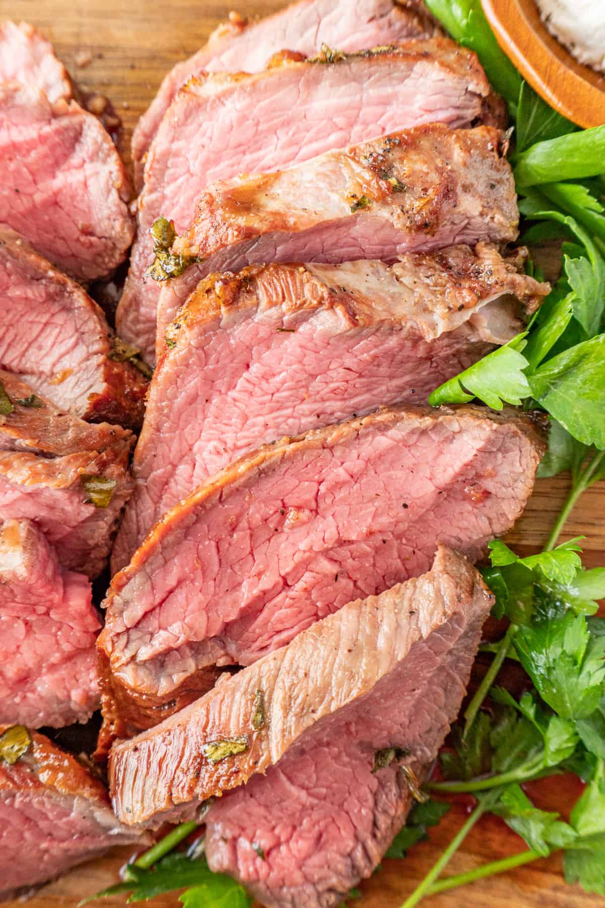 sliced of tri tip on cutting board.