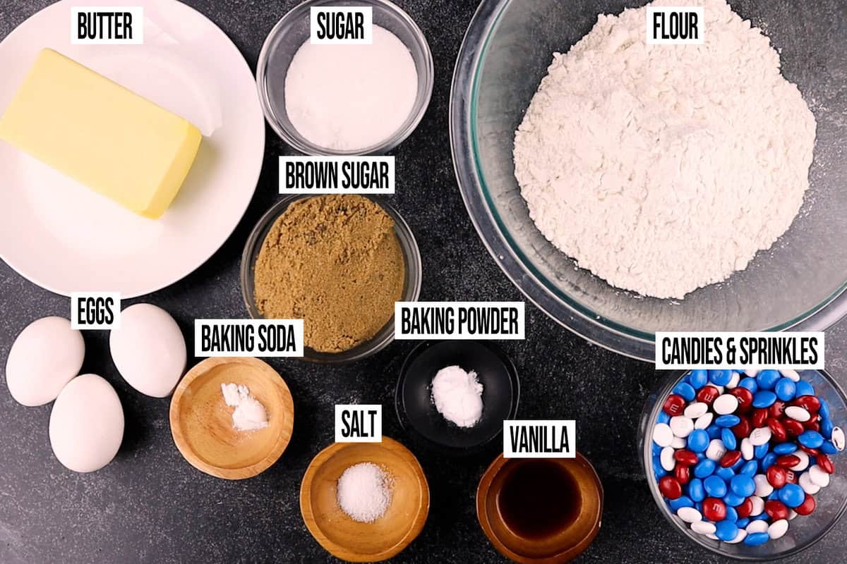 4th of July cookie ingredients in individual bowls and labeled.