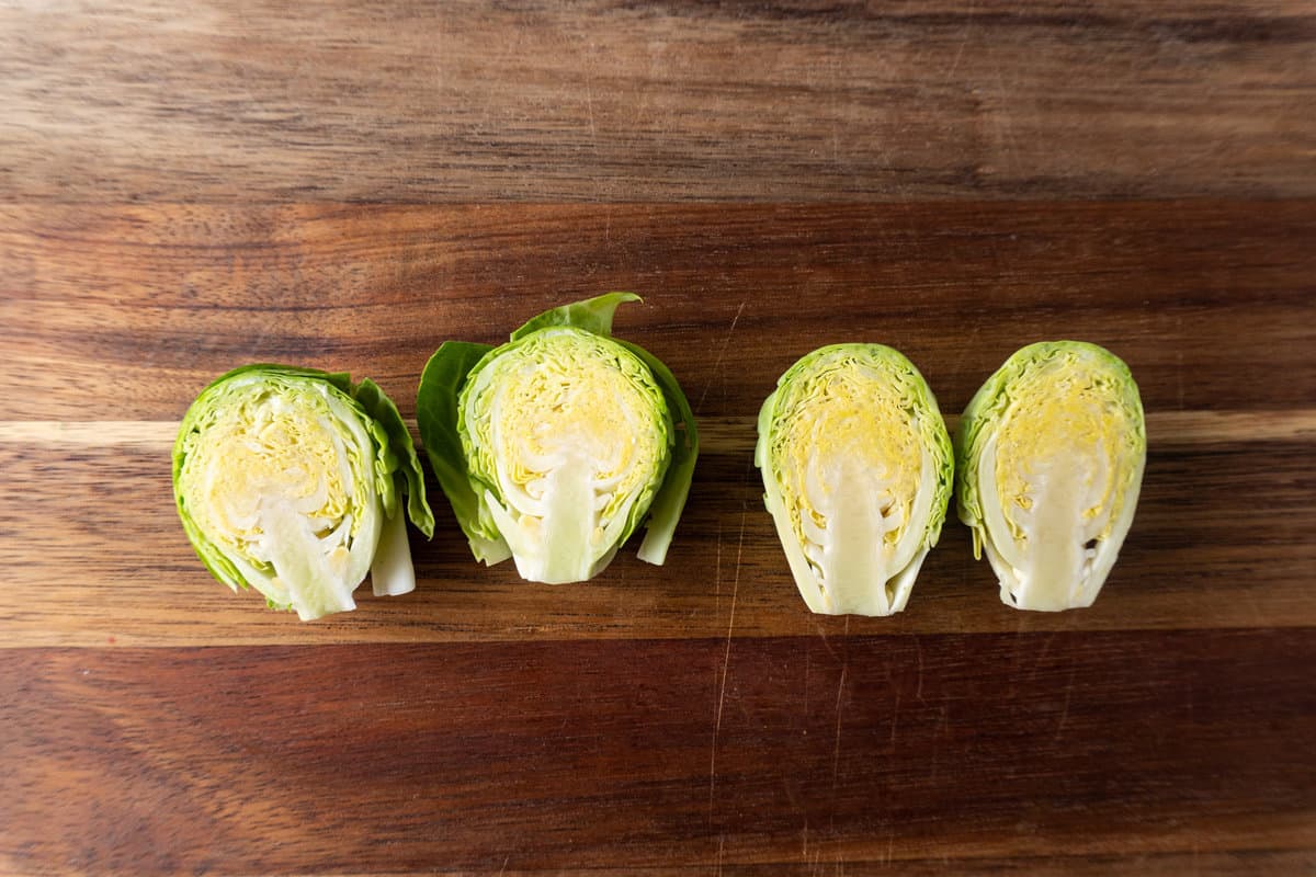 sprout cut in half with loose leaves and sprout with loose leaves removed